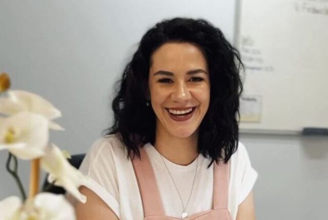 A Nova Life team member smiling in the office